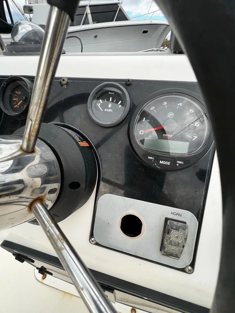 Slide: The Image of Dashboard of a 2002 Key West 1720 Center Console boat. - 14