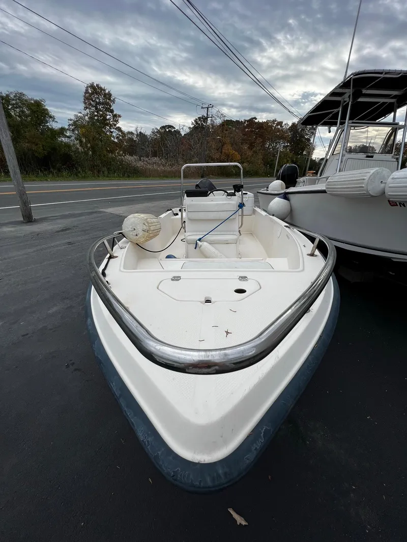 Slide: The Image of 2002 Key West 1720 Center Console boat in parking lot. - 2