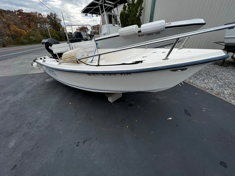 Slide: The Image of 2002 Key West 1720 Center Console boat on parking lot. - 3