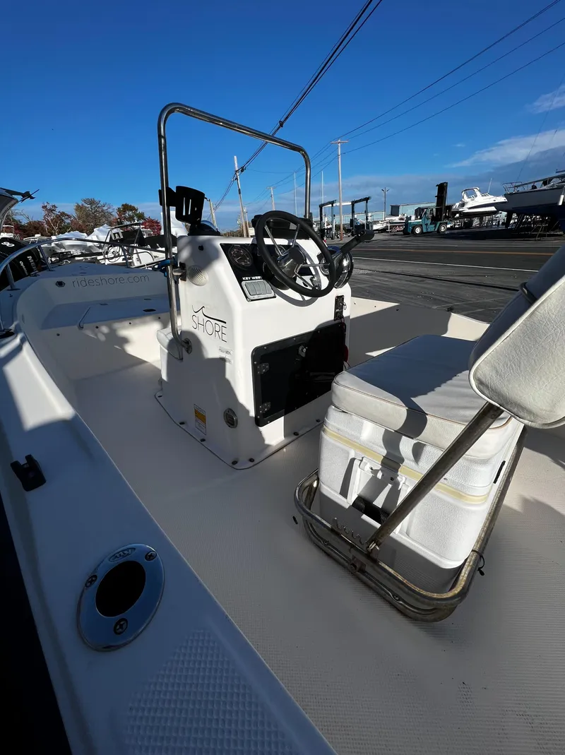 Slide: The Image of 2002 Key West 1720 Center Console boat in a parking lot. - 7