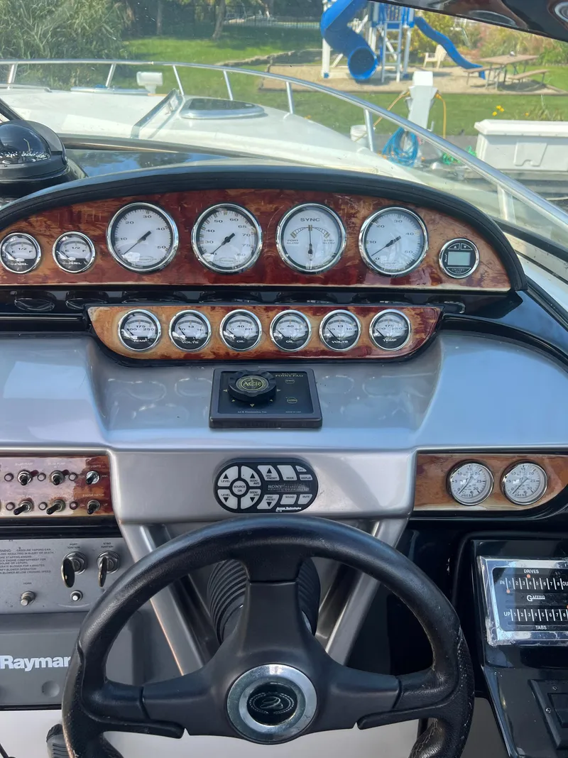 Slide: The Image of Dashboard of a 2003 Cobalt 360 boat with gauges and controls. - 22
