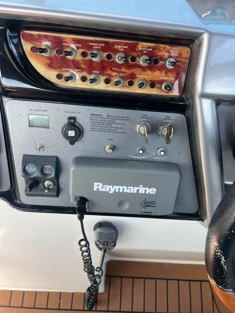 Slide: The Image of Control panel of a 2003 Cobalt 360 boat with Raymarine equipment. - 24