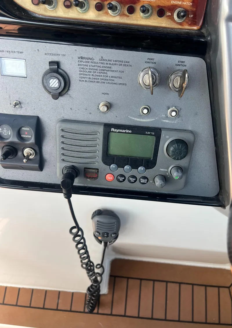Slide: The Image of Control panel of a 2003 Cobalt 360 boat with Raymarine radio. - 25