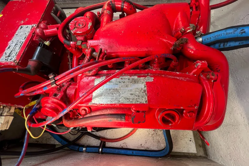 Slide: The Image of Red engine of a 2003 Cobalt 360 boat with visible wiring and components. - 40