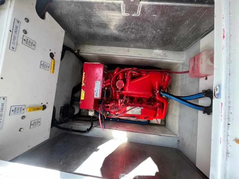 Slide: The Image of Engine compartment of a 2003 Cobalt 360 boat with a red engine. - 41