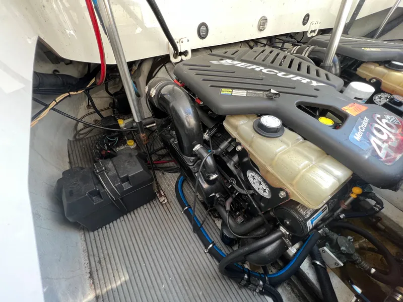 Slide: The Image of 2003 Cobalt 360 boat engine compartment with Mercury engine. - 42