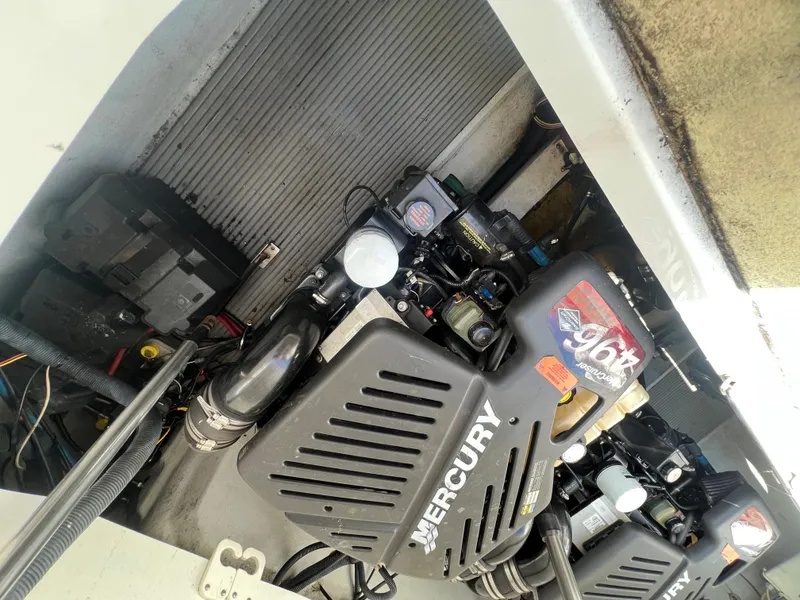 Slide: The Image of Engine compartment of a 2003 Cobalt 360 boat with Mercury engines. - 44