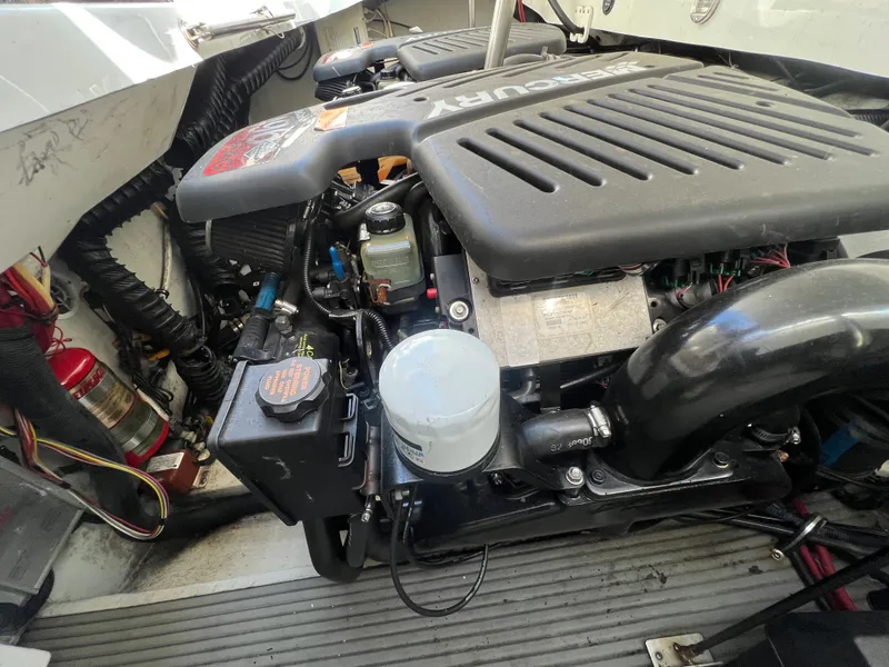 Slide: The Image of 2003 Cobalt 360 boat engine compartment with Mercury engine. - 45