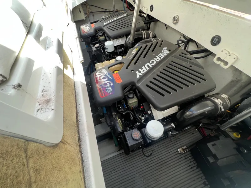 Slide: The Image of 2003 Cobalt 360 boat engine compartment with dual Mercury engines. - 47