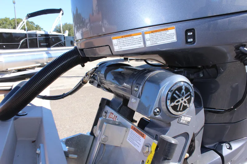 Slide: The Image of Close-up of a 2024 Avid ROGUE boat engine with visible warning labels. - 10