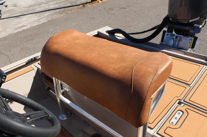 Slide: The Image of 2024 Avid ROGUE boat with brown leather seat and steering wheel. - 17