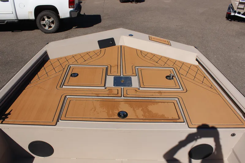 Slide: The Image of 2024 Avid ROGUE boat deck with storage compartments and non-slip surface. - 19