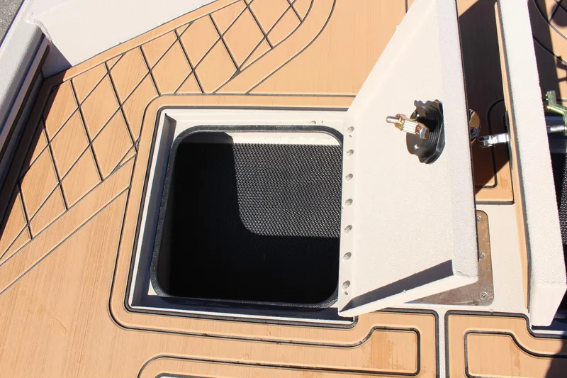 Slide: The Image of 2024 Avid ROGUE boat storage compartment with open hatch. - 20