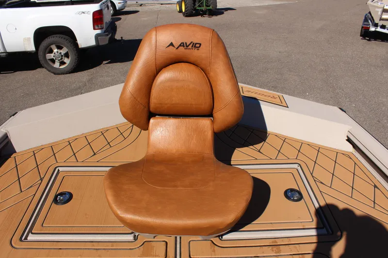 Slide: The Image of Avid ROGUE 2024 boat seat in brown leather on deck. - 25