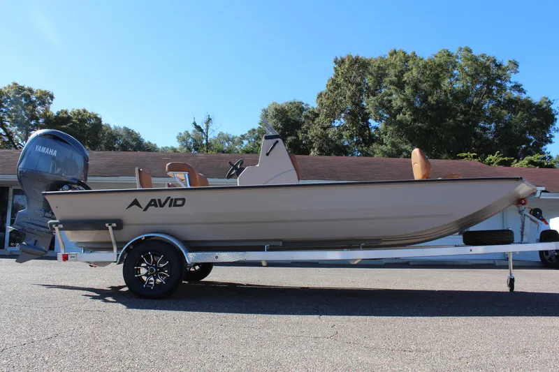 Slide: The Image of 2024 Avid ROGUE boat on a trailer with Yamaha outboard motor. - 7