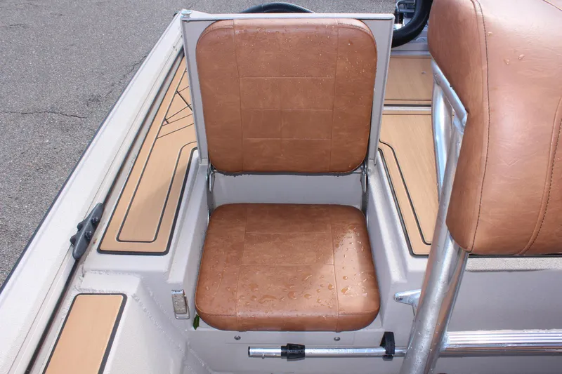 Slide: The Image of 2024 Avid ROGUE boat with brown leather seats and modern design. - 11