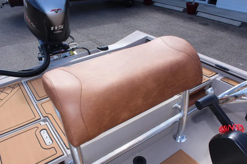 Slide: The Image of Avid ROGUE 2024 boat with Yamaha 115 engine and tan leather seat. - 13