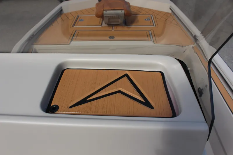 Slide: The Image of 2024 Avid ROGUE boat dashboard with wood accents and modern design. - 17