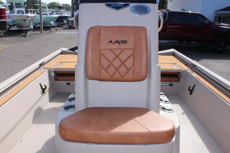 Slide: The Image of 2024 Avid ROGUE boat with tan leather seating and modern design. - 18