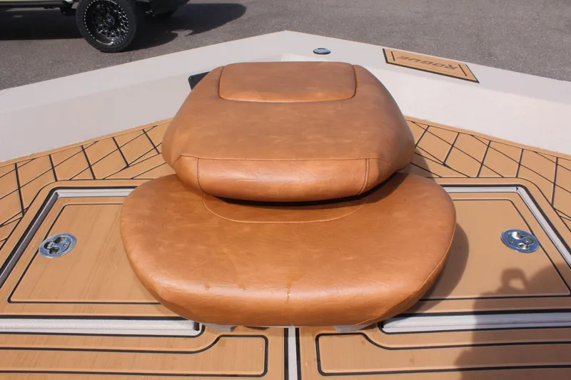 Slide: The Image of Avid ROGUE 2024 boat with tan leather seating and deck details. - 20