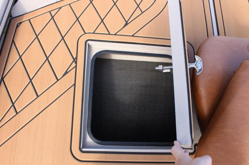 Slide: The Image of 2024 Avid ROGUE boat storage compartment with open hatch. - 21