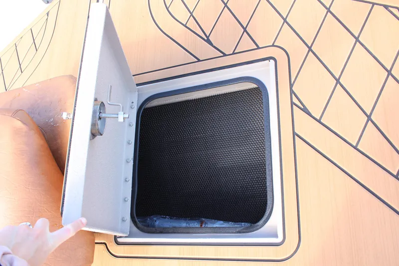 Slide: The Image of Open hatch on 2024 Avid ROGUE boat deck. - 22