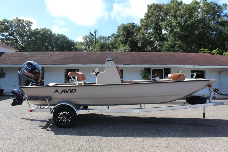 Slide: The Image of 2024 Avid ROGUE boat on a trailer, parked outdoors. - 5