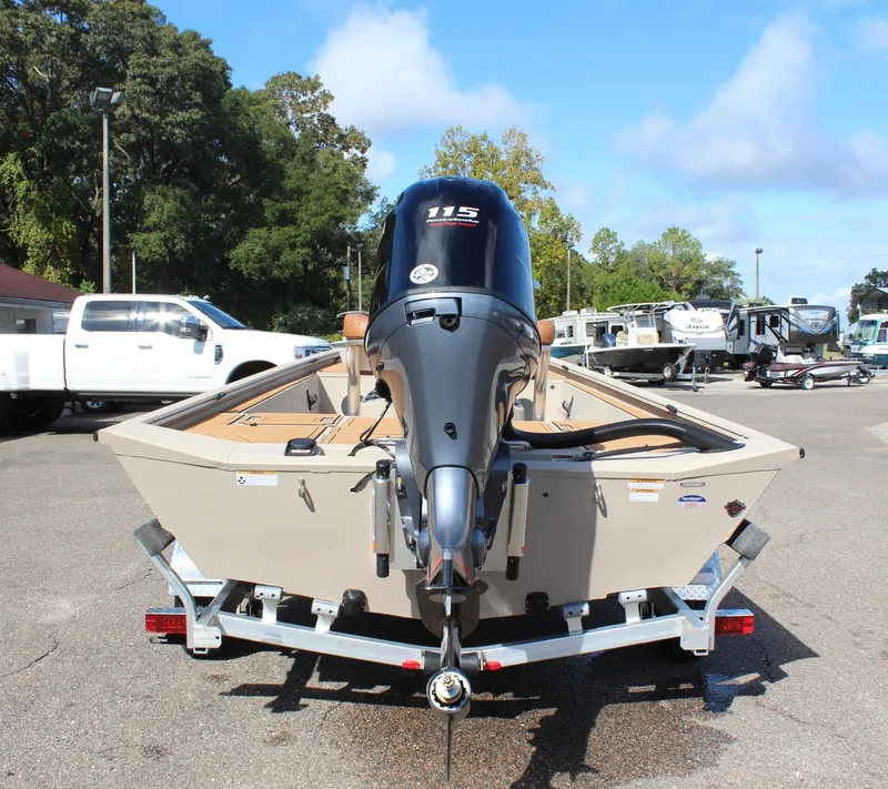 Slide: The Image of 2024 Avid ROGUE boat on trailer with 115 HP outboard motor. - 7