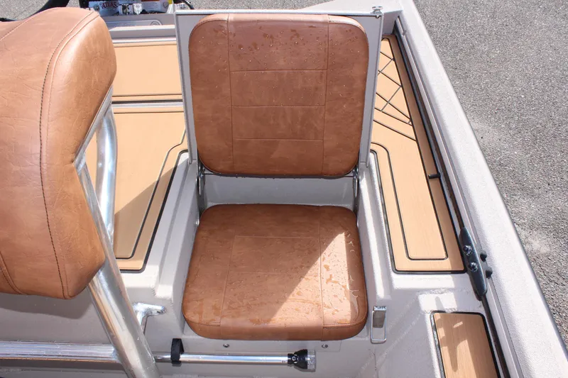 Slide: The Image of 2024 Avid ROGUE boat with tan leather seats and aluminum frame. - 9