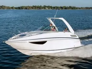 Slide: The Image of 2024 Regal 28 Express boat cruising on a lake. - 15