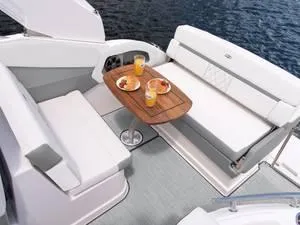Slide: The Image of 2024 Regal 28 Express boat interior with seating and dining table. - 19