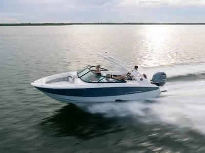 Slide: The Image of 2024 Regal 28 Express boat cruising on open water. - 31