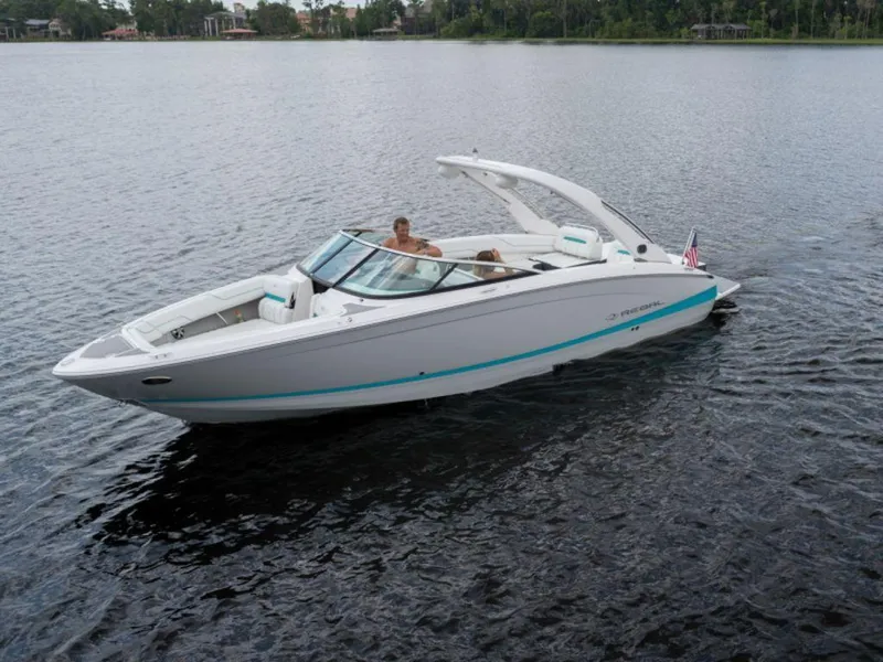 Slide: The Image of 2024 Regal LS6 boat cruising on a calm lake. - 5