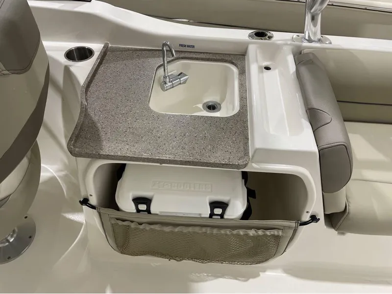 Slide: The Image of 2024 Key West 239 DFS boat interior with sink and cooler storage. - 10