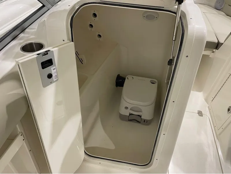 Slide: The Image of 2024 Key West 239 DFS boat interior with portable toilet. - 21