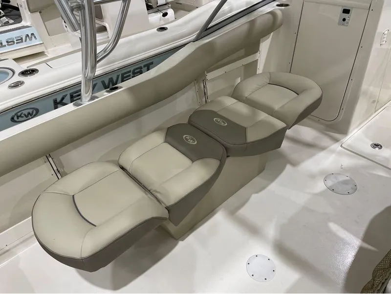 Slide: The Image of 2024 Key West 239 DFS boat interior with cushioned seating. - 8