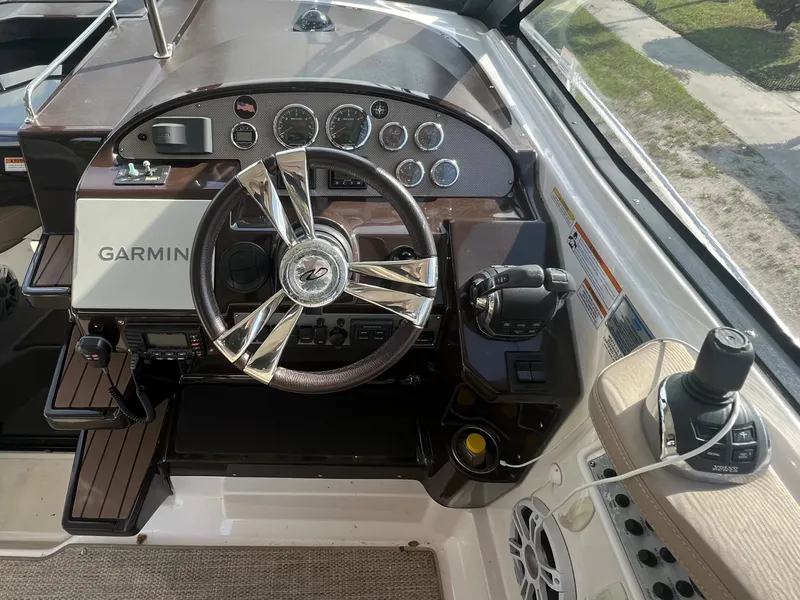 Slide: The Image of 2014 Regal 35 Sport Coupe helm with Garmin navigation system and modern controls. - 17