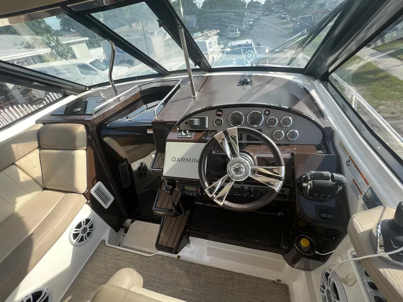 Slide: The Image of Interior cockpit of a 2014 Regal 35 Sport Coupe with Garmin navigation system. - 18