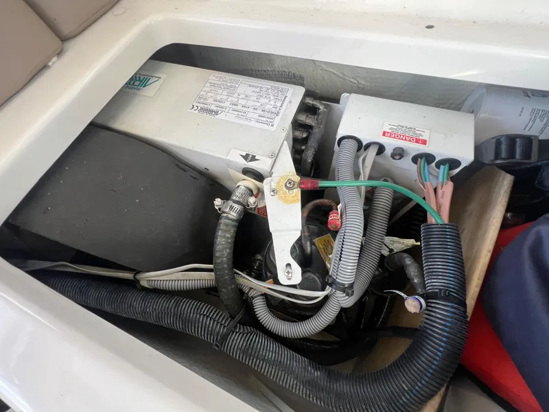 Slide: The Image of Engine compartment of a 2014 Regal 35 Sport Coupe with wiring and components. - 21