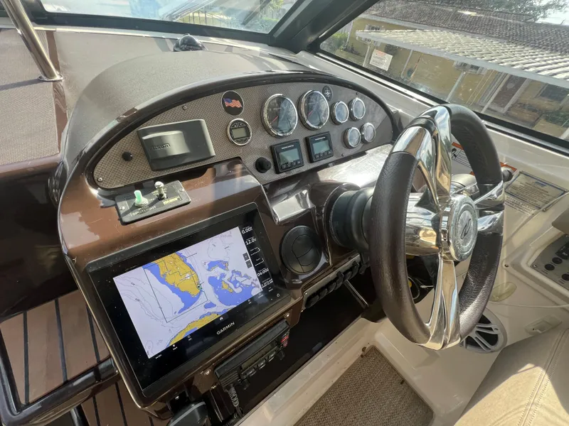 Slide: The Image of 2014 Regal 35 Sport Coupe dashboard with navigation system and steering wheel. - 22