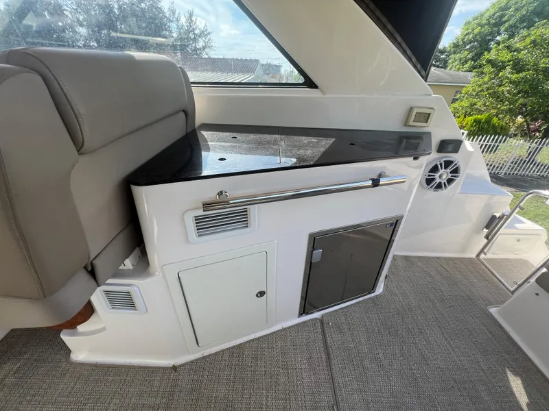 Slide: The Image of Interior of 2014 Regal 35 Sport Coupe with seating and storage compartments. - 24