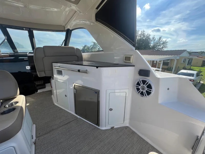 Slide: The Image of Interior of 2014 Regal 35 Sport Coupe yacht with seating and storage compartments. - 26
