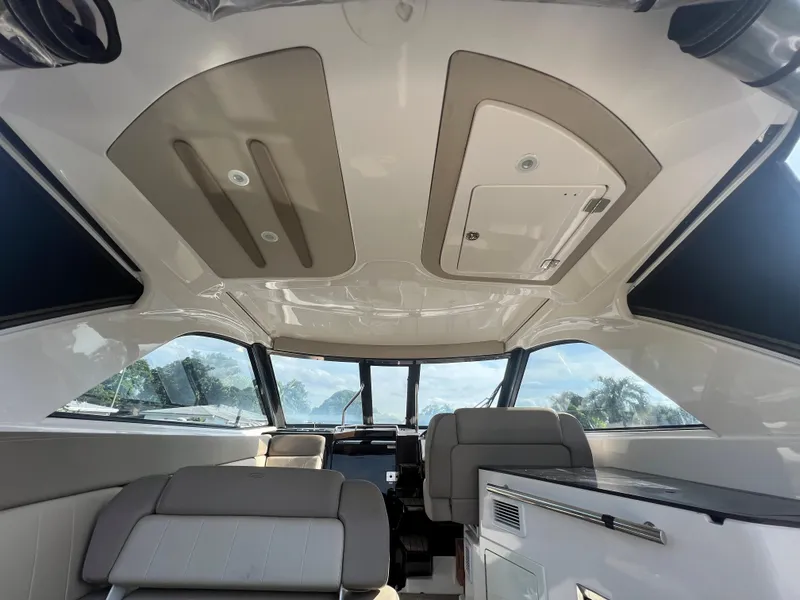 Slide: The Image of Interior of 2014 Regal 35 Sport Coupe, featuring modern seating and panoramic windows. - 27