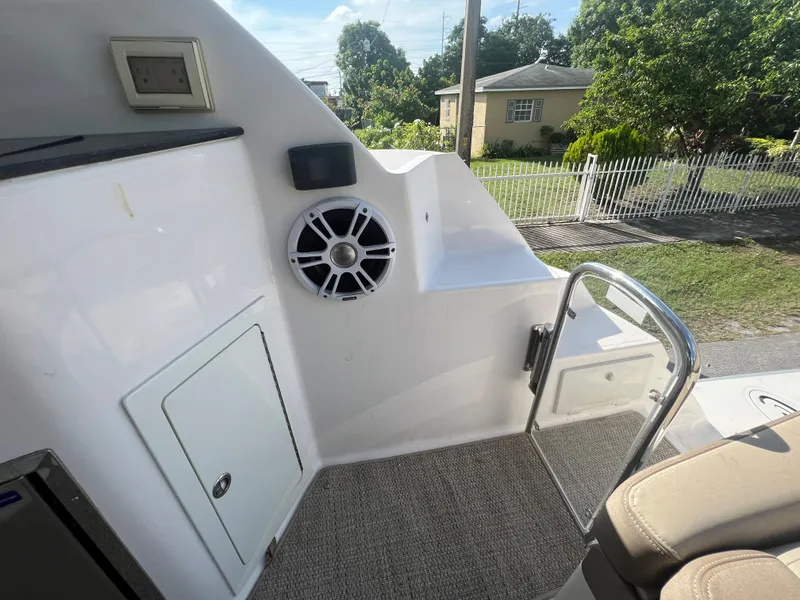 Slide: The Image of Interior view of 2014 Regal 35 Sport Coupe boat showing speaker and seating area. - 29