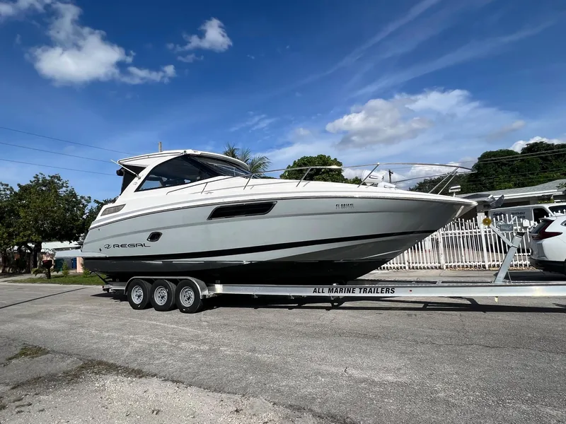 Slide: The Image of 2014 Regal 35 Sport Coupe on a trailer under a clear blue sky. - 3