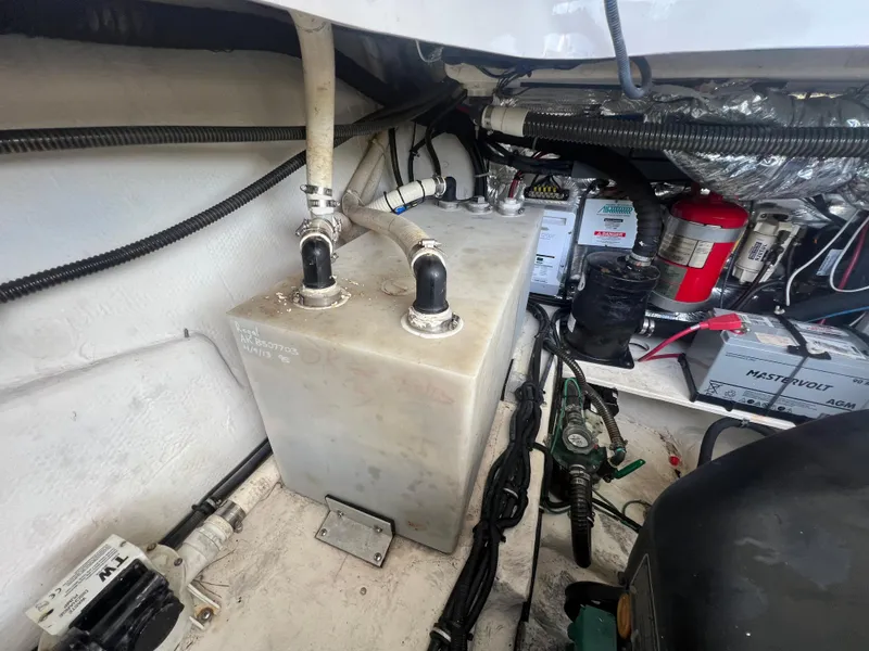 Slide: The Image of Engine compartment of a 2014 Regal 35 Sport Coupe with various components and wiring. - 32