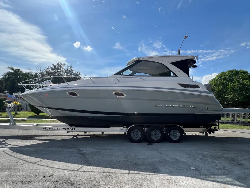 Slide: The Image of 2014 Regal 35 Sport Coupe on a trailer under a clear blue sky. - 4