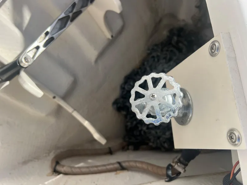 Slide: The Image of Anchor chain compartment of a 2014 Regal 35 Sport Coupe boat. - 45