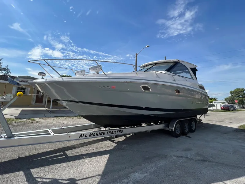 Slide: The Image of 2014 Regal 35 Sport Coupe on a trailer under a clear blue sky. - 5