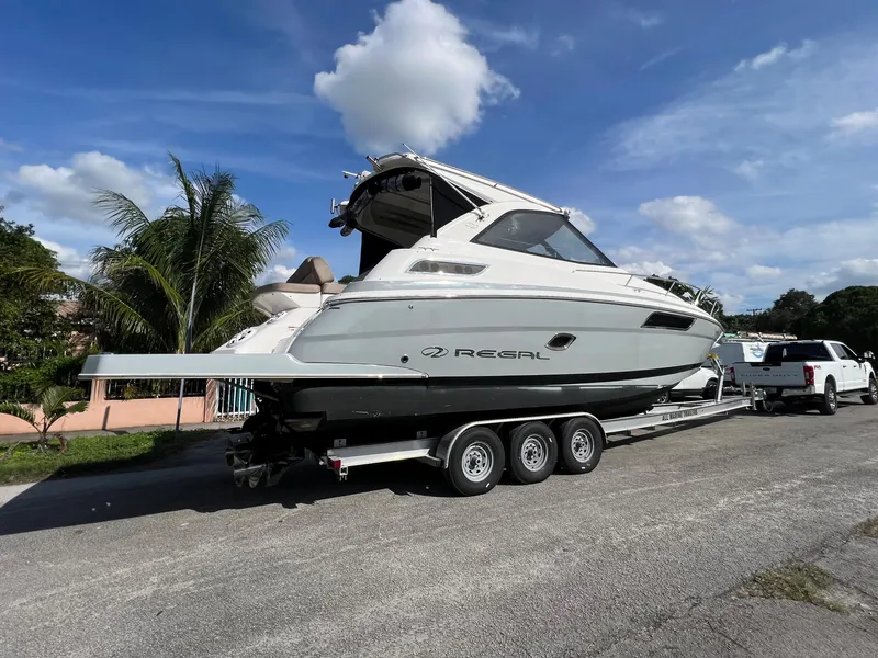 Slide: The Image of 2014 Regal 35 Sport Coupe boat on a trailer, ready for transport. - 6